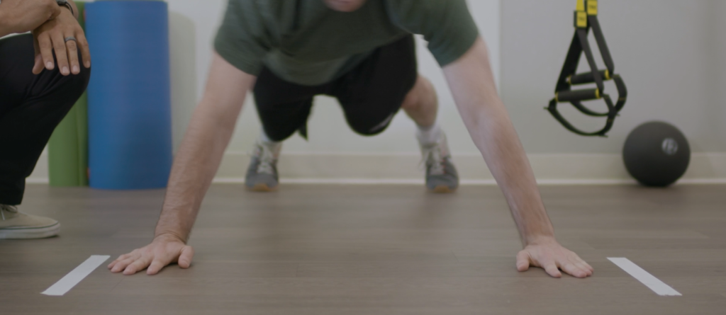 Man doing pushup for a baseline screen